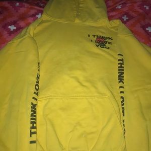 yellow “I think I love you” hoodie by phora .